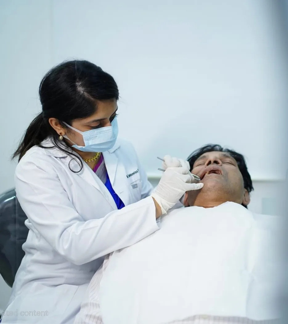 Dentist examining a patient's teeth at Best Dental Solutions clinic in Chennai