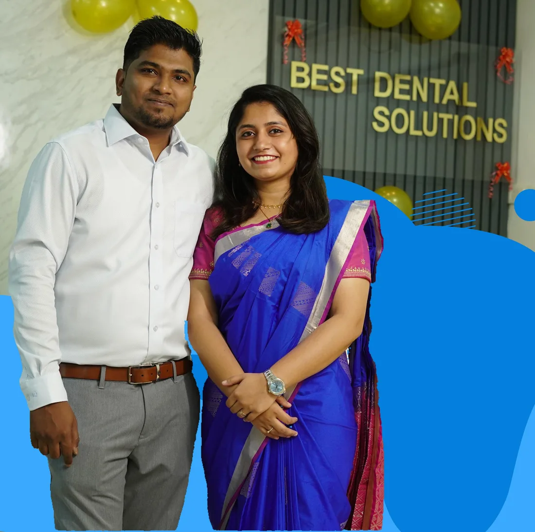 Dentists of Best Dental Solutions in front of the clinic sign